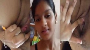 Pretty girl with great breast stimulates her pink pussy with her fingers.