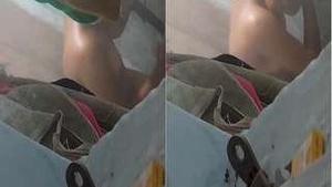 See a homemade video of a young Tamil woman taking a bath.