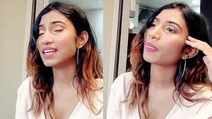 Hot looking woman performs a song and exposes her beautiful body.