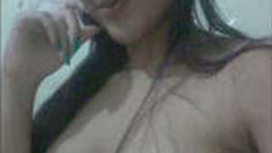 A girl from a particular country enjoys herself by playing with her bouncing breasts