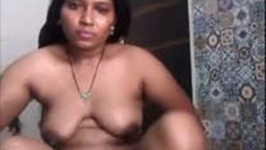 Beautiful Indian house wife taking a bath.