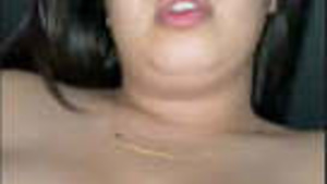 A beautiful woman with big assets married to a Pakistani man.