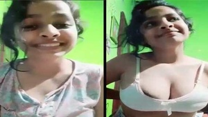 Beautiful woman with beautiful breasts poses for the camera.