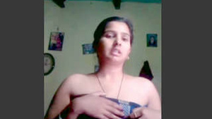 Beautiful wife of a village farmer shows off her curves in public.