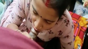 Indian house wife showing off her oral skills with camera man