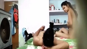 Lovers in college have sex in front of the camera in their home.