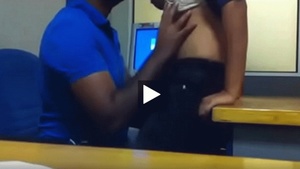 A call center manager has a steamy threesome with a colleague.