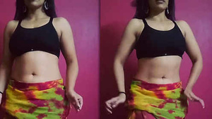 Beautiful woman with big assets dancing sexy dance called the belly dance.