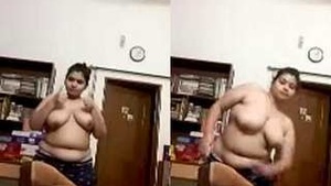 Beautiful Indian woman exposing her breasts during a video call.