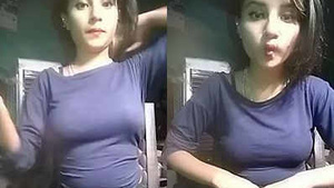 Pretty Indian girl in a figure-hugging dress flaunts her curves.