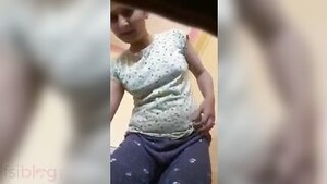 A naughty Indian housewife showing her private parts to her husband during her menstruation.