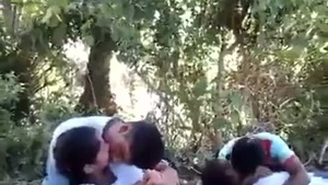 College couples flirt and kiss in the great outdoors in front of their friends.