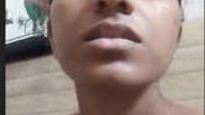 A girl from Sri Lanka is flashing her large breasts and vagina.